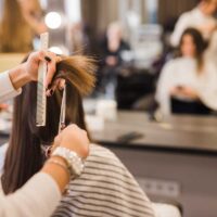 brunette-woman-getting-her-hair-cut